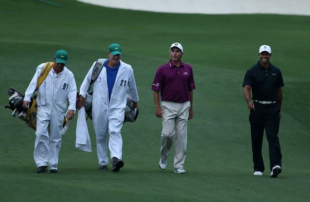 Tiger Woods and Fred Couples with their caddies in white