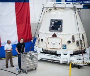 Elon Musk inspects the Dragon after its return from the Space Station