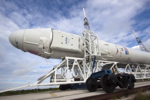 Falcon 9 with Dragon bound for the launch pad for October flight